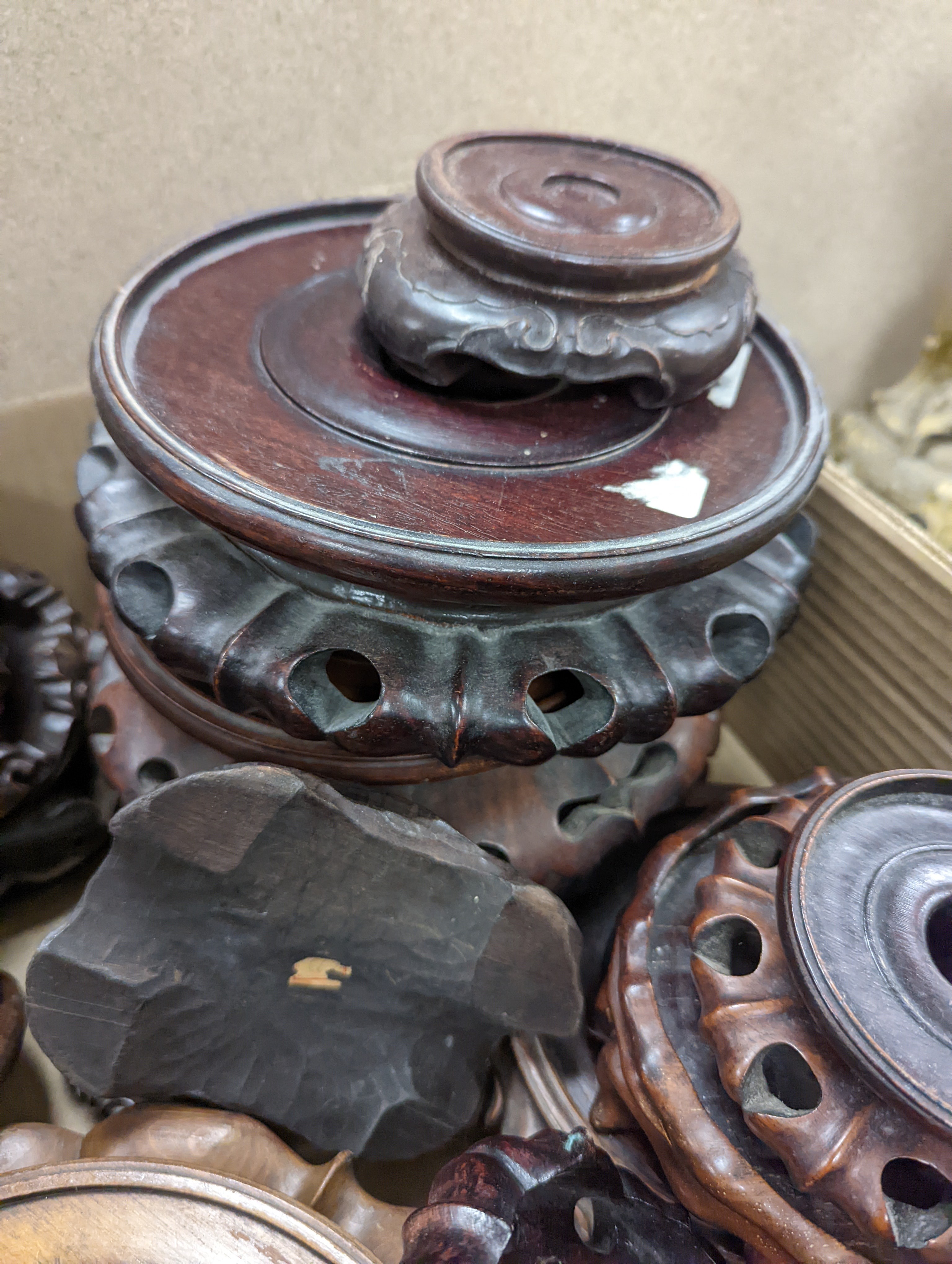A large collection of Chinese hardwood stands.